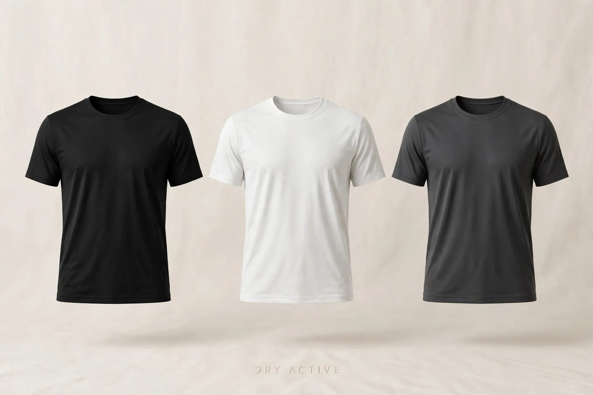 Três camisetas dry fit lisas lado a lado nas cores preta, branca e cinza escuro